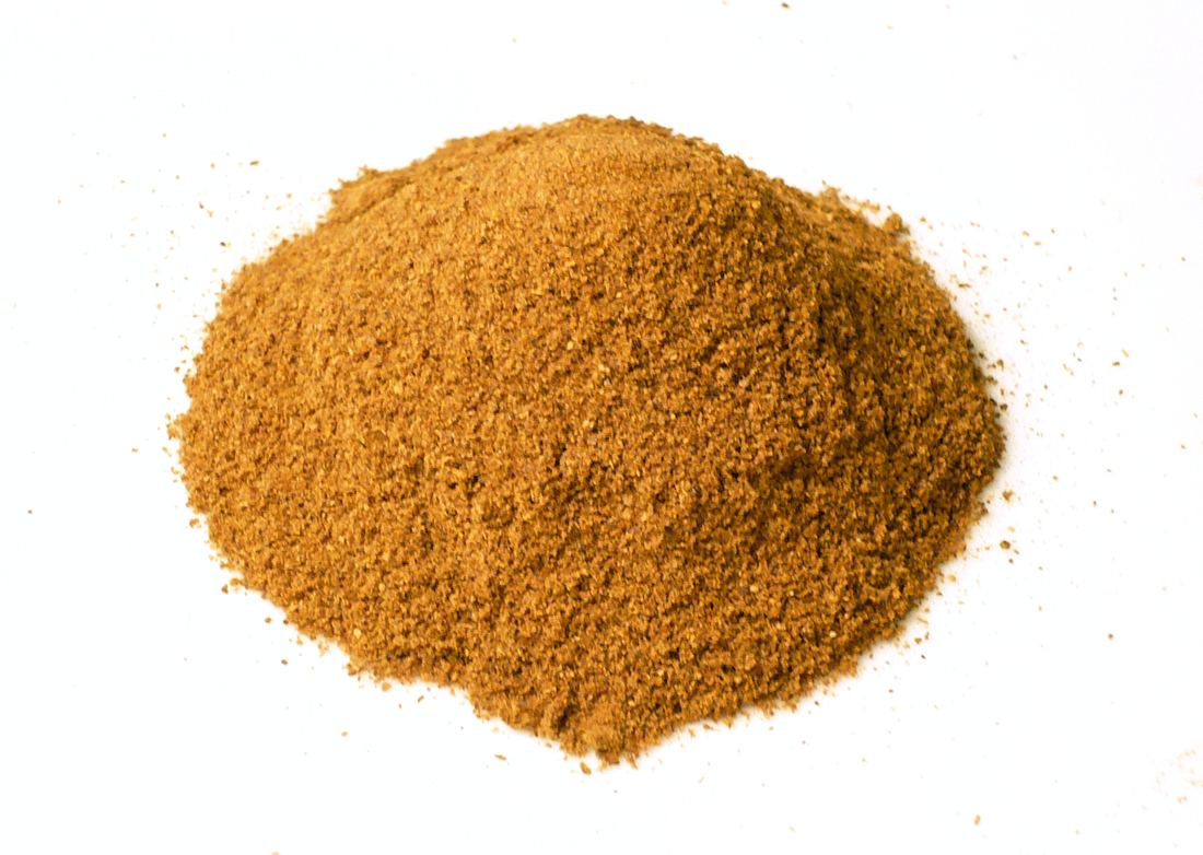 A mound of red-orange berbere spice powder