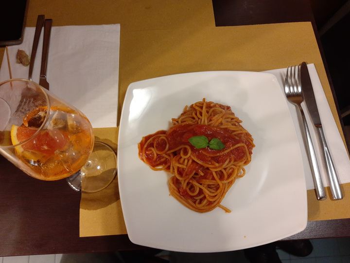A plate of spaghetti in red tomato sauce with basil in a Venice restaurant